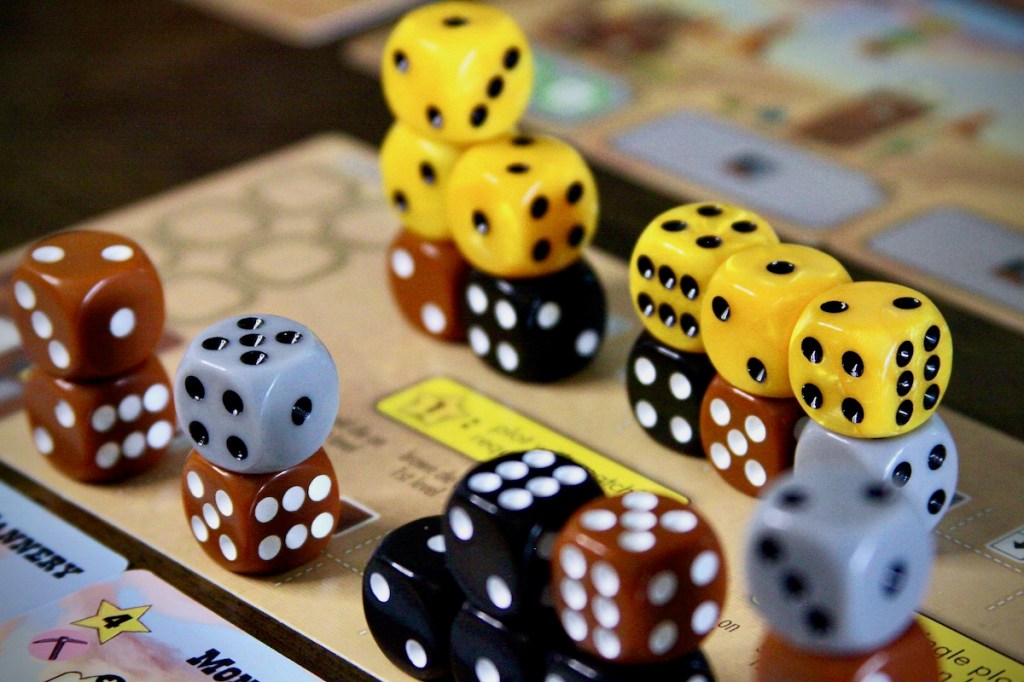 Dice city. The Main Street full of buildings in Tumble Town board game by Weird Giraffe Games