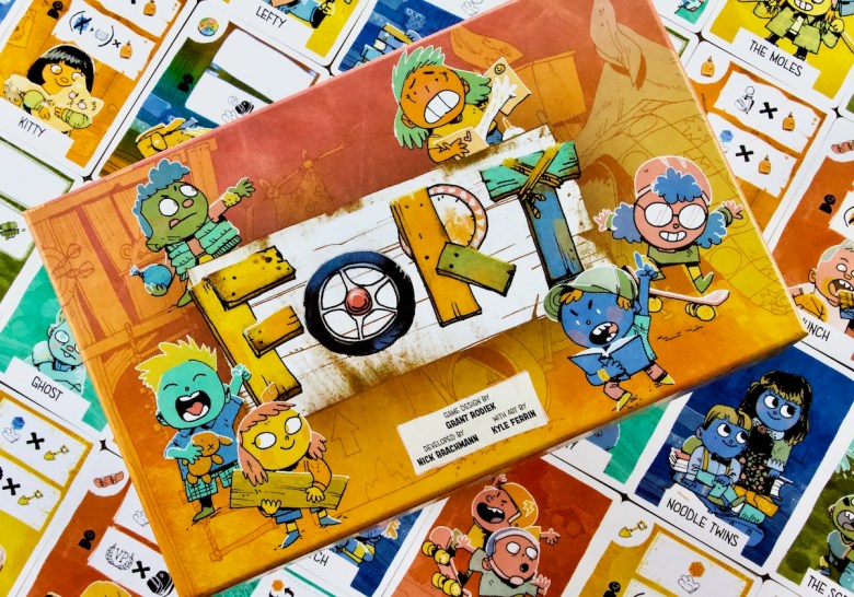 Box cover and kid cards in Fort by Leder Games