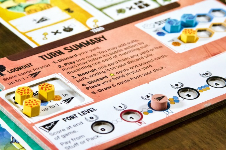 Player board, yard, pizza and toys in Fort by Leder Games