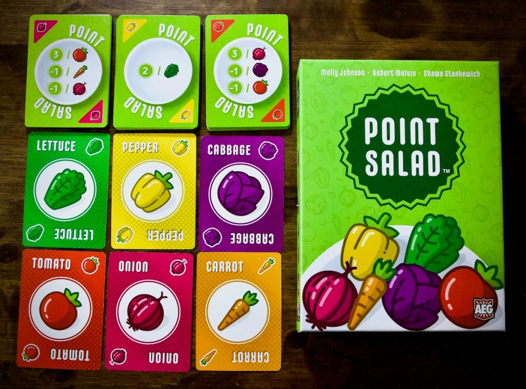 The vegetable market in Point Salad by AEG, Flatout Games featuring cabbage, pepper, lettuce, tomato, onion and carrot