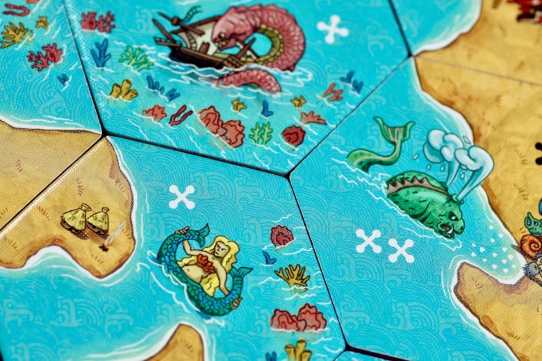 Tile placement game featuring mermaid, coral, and sea monsters - Land vs. Sea by Good Games Publishing 