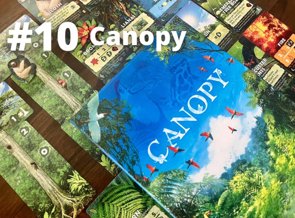 Canopy card game showing some cards and cover art