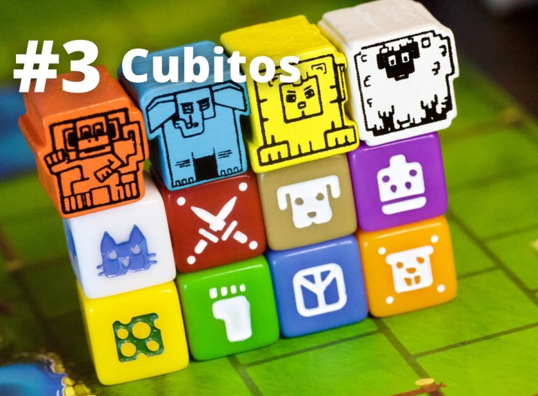 Cubitos characters and dice featuring a monkey, elephant, lion and sheep and several bright unique dice
