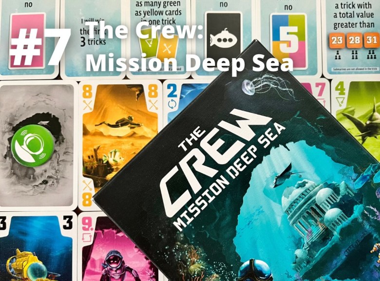 The Crew Mission Deep Sea trick taking card game is pictured showing the box and a selection of cards from the game