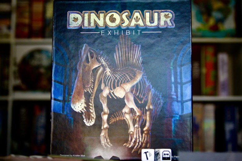 Spinosaur fossil on the cover of the Dinosaur Exhibit boardgame
