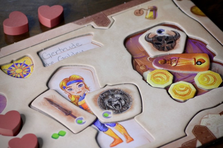 Dual layer player board complete with customized hero in Chronicles of Avel